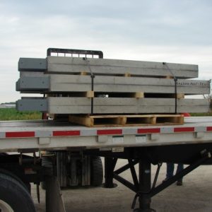 specialty precast concrete columns loaded on a truck trailer