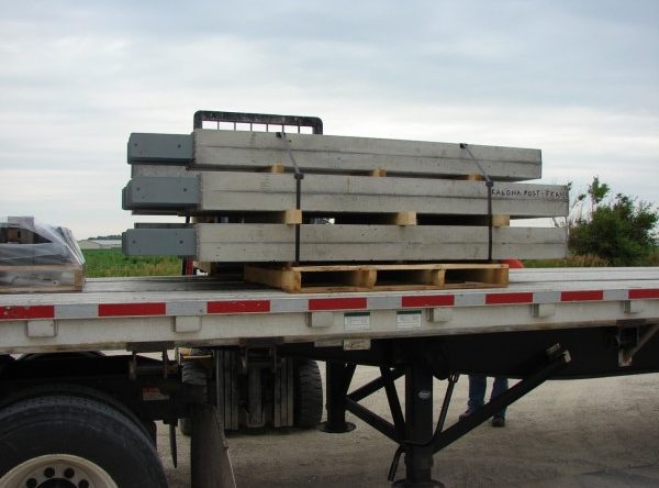 specialty precast concrete columns loaded on a truck trailer