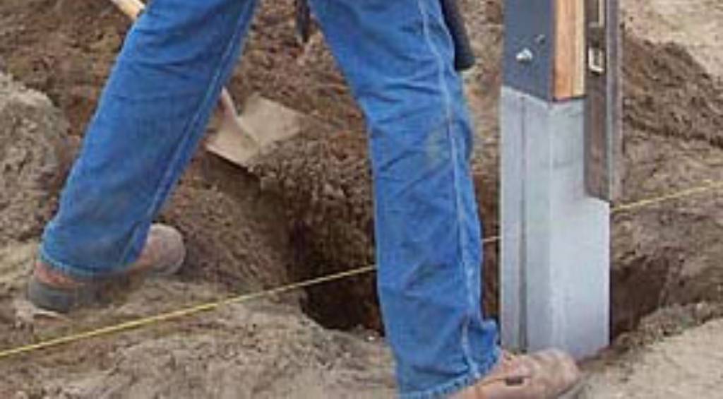 concrete perma column installation with worker in jeans